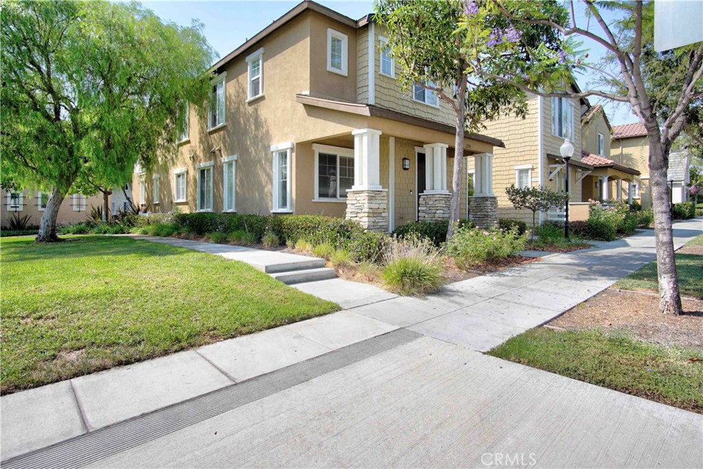 LOCATED NEXT TO A SMALL PARK WITH VIEW IN ALL SOUTH SIDE WINDOWS! Original owner lovingly and meticulously maintained this property. One of the best areas in a newer development in Fullerton, built by The Olson Company, in the prestigious Amerige Heights "Gallery Walk" Community. This property sits literally across the street from Robert Fisler Elementary/Junior High. Awesome end-unit with attached only on one side. Three bedrooms & 2.5 bathrooms; this delightful two story home is warm, inviting and has a fantastic floorplan for great entertaining. Beautiful light color hardwood flooring downstairs, large half bath with white pedestal sink, upscale living room with fireplace; open, spacious kitchen with tile countertops, oak cabinets, newer stainless steel/black appliances, large center island, recessed lighting & large dining area. Handy laundry downstairs. Private master bedroom with dual sinks and mirrored closet doors. Jack & Jill bathroom, one of the bedrooms has a walk-in closet. Direct access to the 2 car garage plus guest parking nearby. HOA dues include high speed internet. Award winning schools with a very short walk to them and also to Amerige Heights Shopping Center. Also walking distance to Sunny Hills High School. Convenient location, close to Metrolink Station, parks, grocery markets, banks, transportation & golf courses. Surroundings are very well kept by HOA. Enjoy Association pool/spa/picnic area/greenbelt/club house/tennis courts.