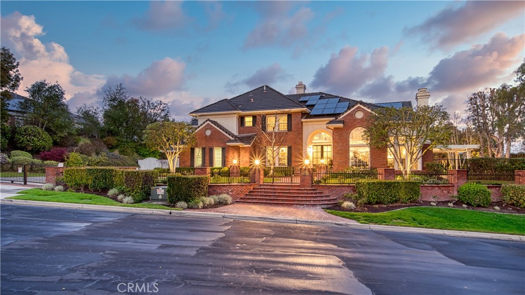 Welcome to 24 Panorama, the crown jewel of the neighborhood. This exceptional estate offers five bedrooms, four and a half bathrooms, and over 5,000 square feet of luxurious living space, all set on a sprawling 35,000-square-foot lot. Designed with both elegance and functionality in mind, the home features a gourmet chef’s kitchen, complete with design features throughout, Carrera Marble with Mother of Pearl Backsplash,Wolf Appliances, a wet bar, 124 bottle wine refrigerator, an under-counter ice machine, and beautifully crafted custom kitchen cabinetry. The grand entryway is illuminated by a stunning Ebanista Montovani Crystal Chandelier, setting the tone for the refined craftsmanship found throughout the home. The master suite is a true sanctuary, boasting a double-sink vanity, expansive showers, separate laundry area and a luxurious steam shower for ultimate relaxation. A dedicated home office, outfitted with magnificent custom cabinetry, provides the perfect workspace. Step outside into your private backyard retreat, where you'll find a resort-style pool with color changing led lighting, a covered lanai patio with built-in speakers, a bar, and three built-in heaters, ensuring year-round comfort and entertainment. This estate has been meticulously upgraded with some of the finest custom finishes you will find including newer HVAC systems, re-piped plumbing system, owned solar system, enhanced landscape lighting in both the front and backyard, and a state-of-the-art MyQ smart garage door system. Additionally, a whole house Waterboy water softener system, a brand-new LiftMaster Slide Gate operator has been installed for added convenience and security. For peace of mind, the property is equipped with a comprehensive Bay Alarm security system, featuring five outdoor surveillance cameras for 24/7 monitoring. All of this is located within the prestigious gated community of Coto de Caza, where residents enjoy access to world-class golf, tennis, equestrian facilities, scenic hiking and biking trails, top-rated schools, and beautifully maintained parks. Experience unparalleled luxury and modern amenities at 24 Panorama—a home where elegance meets innovation.