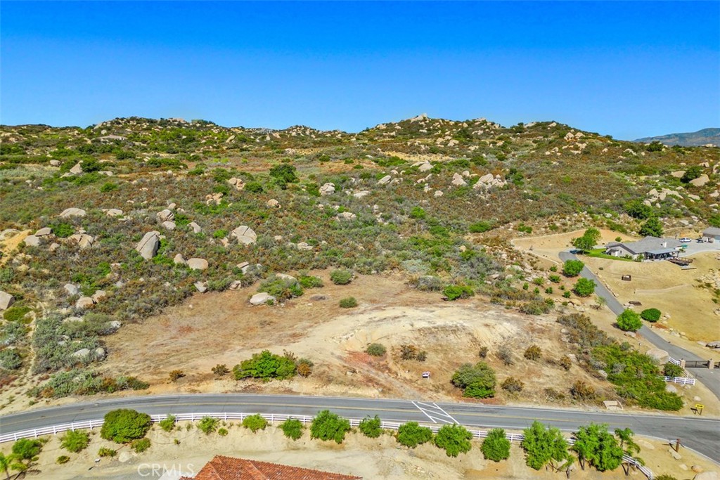 Price Improvement! Welcome to California's Best Kept Secret! Impressive 4.76 acre parcel of land located in the prestigious area of La Cresta Highlands. Featuring Stunning valley, mountain & city light views! ~Utilities at paved street~ Great area's to build your dream estate, guest home, pool, groves & gardens. A true hill top paradise with incredible natural boulder outcroppings! Surrounded by multi-million dollar estates and ranches! The perfect opportunity to enjoy country living at its finest within minutes from all modern conveniences, award winning schools, restaurants, premier golf courses, shopping malls, hospitals, world renowned wineries, resorts & I-15 freeway. Less than 1.5 hours from LA, San Diego, Palm Springs, Beaches, Mountains & Theme Parks. Discover and enjoy the La Cresta Highlands lifestyle with twinkling star filled skies, scenic open space, private trails, Santa Rosa Plateau Ecological Reserve & lovely community events! Truly the epitome of peace & tranquility!