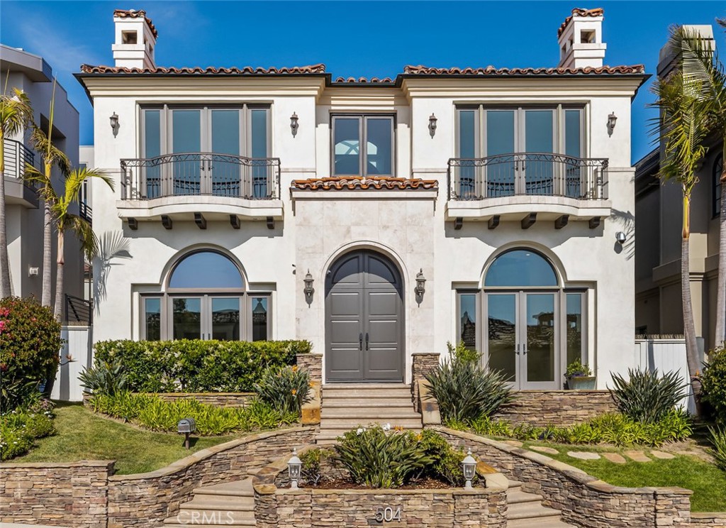 Enjoy the Manhattan Beach lifestyle in this fabulous Mediterranean Hill Section Home. This timeless home showcases unblock-able, panoramic, Pacific Ocean views. Located on one of the most coveted streets in Manhattan Beach, the home is comprised of approximately 5000 square feet and was designed by architect Louie Tomaro. It features 5 bedrooms, 5 bathrooms, includes a basement and guest house with a 3-car garage. The sun filled, open upper-level floor plan, offers coastal Catalina to Malibu views from the west facing living room. The rest of the level comprises of a sunken family/tv room with 7.1 surround sound speakers, breakfast nook, kitchen, walk-in pantry, dining room, and powder room. The gourmet kitchen boasts two Bosch dishwashers, a SubZero refrigerator, two full size Thermador ovens, and an oversized island with prep sink, 5 burner Wolf stovetop, and butler’s pantry (featuring dual SubZero refrigerator drawers and a Thermador warming drawer). Bedrooms are located on the lower level along with ample closets, laundry room and an ocean viewing library/sitting room. The oversized, primary bedroom suite also presents ocean views and encompasses a wrap-around walk-in closet and natural light filled bathroom with dual sinks, multi-head shower, and jetted bathtub. The expansive, private backyard is perfect for entertaining and includes a sports court, outdoor fireplace and stone terrace patio. Watch every magnificent sunset, entertain guests, walk to Downtown Manhattan Beach, and more, when you make this beautiful home yours. **Some rooms have been virtually staged**