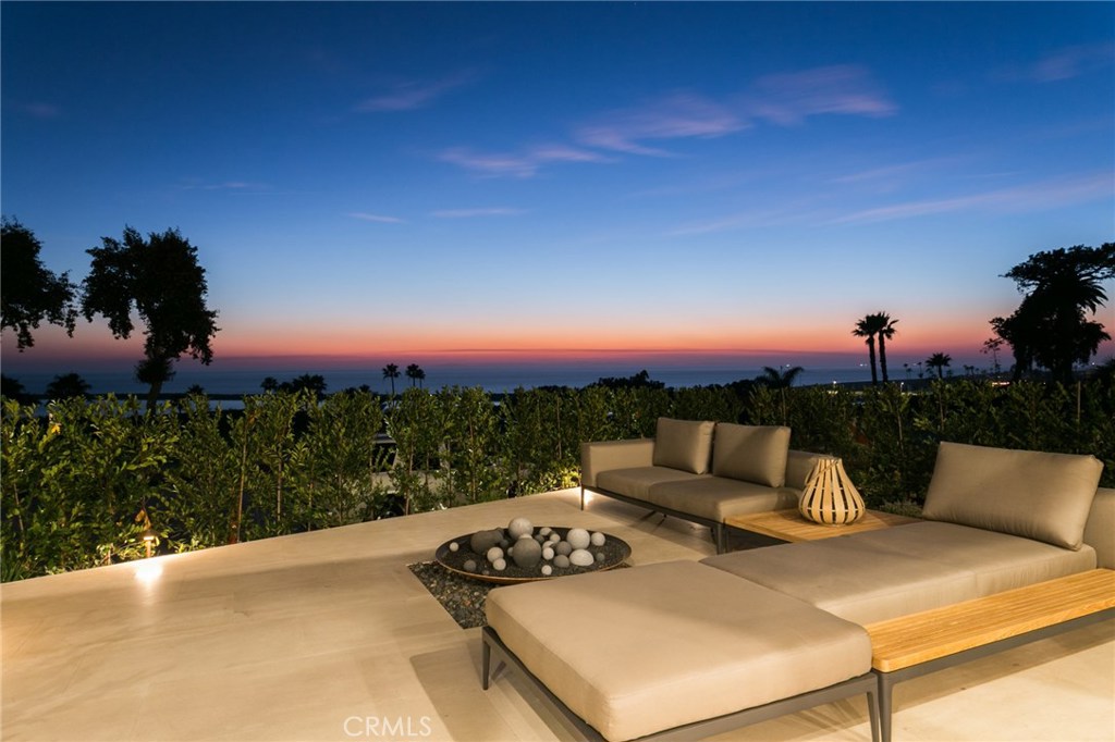 The scale and expanse of this landmark home seamlessly blurs the line between indoor and outdoor spaces. Breathtaking ocean and harbor views welcome the crisp ocean breeze with the fully automated glass wall system. This 5 bedroom, 6 full bathroom, 2 half-bathroom, 7,723 square foot home is meticulously designed to captivate and enliven the coastal appeal. Adorned with rich wood and stone materials throughout, 2914 Ocean Blvd. tastefully blends luxury with livability. Entertain in the midst of colorful sunsets on a spacious deck, overlooking the California Riviera. Designed by renowned architect, Geoff Sumich, and built by luxury home builder, Nicholson Companies; this home represents the best of ocean front living.