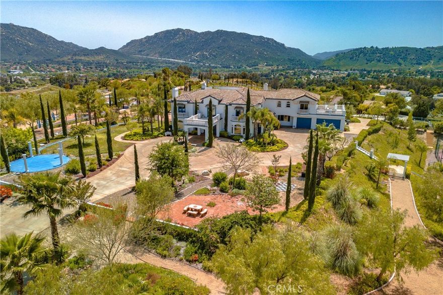 ****SIMPLY THE MOST AMAZING PROPERTY WITHIN THE CITY OF TEMECULA!!  This Resort-Like custom colonial Spanish Mediterranean property located in the prestigious Chaparral/Santiago Estates is for the people who want it all.  Be King of the Hill!  The possibilities for this site are endless... Corporate Retreat, potential Bed and Breakfast or multi-generational Family Compound.  15 acres of amazing privacy with gorgeous 360 degree views, fabulous sunsets, city lights, snow capped mountains, the entire valley at your feet.  Main house is approx. 6,747sf, Guest house 915sf plus art studio/ workshop, Pool Casita 709sf, plus multiple entertaining rooms on property, and exquisite gardens, raised vegetable garden, and numerous fruit trees.  Lighted Tennis Court, basketball, sand volleyball, pickle ball, horseshoes, 76 foot Bocce Ball court/ horse corral, planted vineyard.  Numerous outdoor entertaining areas.  Main house has 6 full en-suite bedrooms plus office, four car garage. Unique triangular concrete garden with balustrades for lavish parties and get togethers.  Best of all, this property is located in the heart of town, close to Old Town, freeway, schools, Pechanga, shopping.  Wonderful chef's kitchen with large island, dual sinks, seated bar, new 8 burner Viking Stove with griddle, double ovens w pot filler, Thermador with double ovens, warming tray, Sub zero Refrigerator, 2 Bosch dishwashers.  Coffee area/ butler's pantry/ walk in pantry.  Gigantic master bedroom deluxe suite with fireplace, and the largest closet rooms you've ever seen!  This place is built for entertaining at a large scale or intimate gathering.  You, your family and your guests will feel like you're on vacation all the time.  There is so much to offer, that once you enter the gates, you'll never want to leave.  Your annual 4th of July party will be your grand soiree as you see fireworks all around from your private enclave on the top of the world here in Temecula!  The house has been professionally decorated and is a complete showpiece with no expense spared.  One of the best features is the secret interior courtyard in the center of the house which adds natural light throughout.  Once you drive up the winding driveway to the Porte-Cochere and open the ornate entry doors and see the beautiful tropical mural hand painted by a local artist, you'll know that you've ARRIVED!  These opportunities don't come up often, so don't miss out!  This is truly a one of a kind property in Temecula.