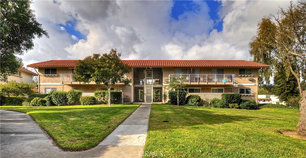 Don't miss out on this MOVE-IN READY LOWER LEVEL Casa Contenta unit. Kitchen features are granite counters, recessed lighting and a glass tile backsplash. Spacious living room has newer windows and sliding glass door that lets in lots of natural light, the balcony is perfect for the evening sunsets. Guest bedroom also has a sliding glass door to the balcony for extra natural light. Master bedroom features a dressing area, 3 closets, bathroom with a shower, vanity and washer and dryer which are included! Guest bathroom includes a tub and shower. Your new home also features laminate flooring, two tone designer paint and newer dual pane windows and sliders. The Community of Laguna Woods Village features: 2 golf courses, 10 tennis courts , 5 pools, 3 fitness centers, Bridge Card Room, 7 club houses, Equestrian Center, 3 Computer Labs, Performing Arts Center, 250 clubs & much, much more. Laguna Woods Village is close to Shopping, Dining, Medical Facilities, Freeways, Beach & More! The Unit includes: water, trash, basic cable, landscaping, and exterior building maintenance plus access to all Laguna Woods Village Facilities. Steps to Carport with Storage and Lots of Guest Parking Makes it Convenient for Visitors. Enjoy the "Gold-Standard" in Senior Living.