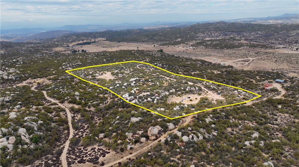 19.33 Acres of beautiful land in Aguanga. Property has WATER WELL, ELECTRIC METER, SEPTIC, FULLY FENCED WITH CHAIN LINK!! This parcel has privacy, views, several usable areas of land combined with native brush and some boulders. Great location off the beaten path but still accessible. 3800 FT elevation provides mild 4 season weather. Come build your homestead in Aguanga! 30 minute drive to Temecula. Directions to property: Tule Valley Left evening Star Right Carrot R Kearsage to the end where it meets Sycamore Springs. *** Bank financing available with as little as 15% down payment ***
