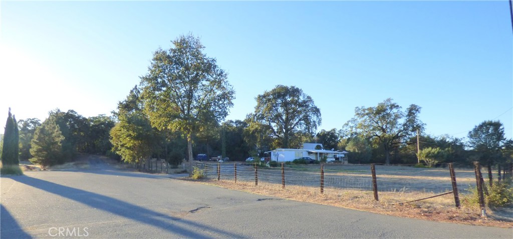 Huge price reduction - owner says sell! Developers,here is your chance. Fantastic opportunity to buy and develop a large commercial parcel in the "growth area" within the city of Lakeport. Zoning is "PO", which is Professional office, also allowed under zoning is multifamily residential, with the issuance of a use permit and several other options with a use permit.
Frontage on Parallel drive is approximately 289' and up Chester Ln approximately 450'.
The location is unsurpassed with Mendocino College , Lake Campus a little south, and two other professional offices close by.
The property has high visibility and is located within easy access and sight off the free way.
The property currently has an older mobile home and an old barn style garage. The property is rented and could provide some income as plans are developed. Please do not disturb tenants. Property is currently served by a well, but city water is readily available and so is city sewer.
Drive by take a look and call us for more details.
This should be an easy build with so much parking opportunity. Over 2.6 acres - all usable!