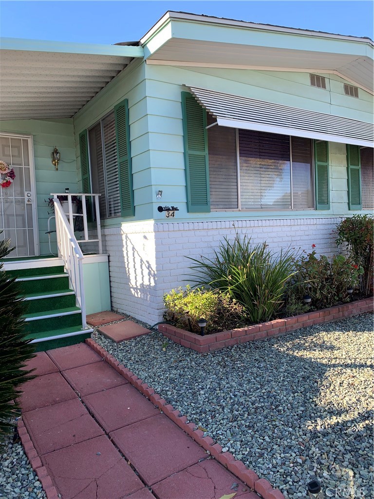 WELCOME to this CHARMING, very well taken care of 1976 Mobile located in a very desirable Senior 55+ community priced to sell. Come enjoy this 1440 sq ft, 2 bedroom, 2 bath mobile. Porch area has been enclosed for additional living space. Kitchen is very open, with pantry, stove top & built in oven & refrigerator included. The yard is low maintenance with rock landscaping, with an outdoor shed for storage. The park is very active with several amenities such as Bingo, chair Volleyball, card games. Holiday Parties for your enjoyment! Drive by and check it out. Come take a tour! Everyone is very friendly!!