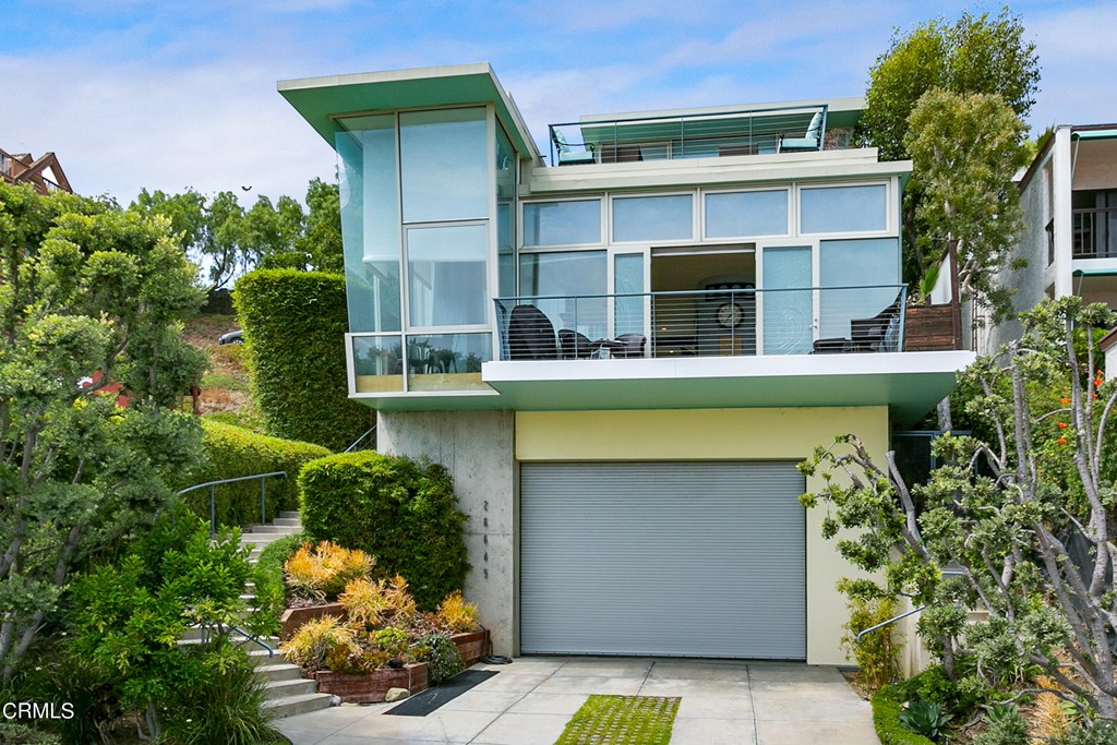 Modern design meets casual, coastal elegance in this must-see Malibu home that commands breathtaking ocean views. Tucked away in the exclusive Latigo Beach community, this magnificent abode features four bedrooms and four baths in the main house and a one bedroom guest house offering its own private entrance. Step inside the impeccably crafted interior to discover open-concept gathering areas, soaring ceilings, walls of glass, and a color palette evocative of your stunning natural surroundings. Shimmering Pacific waters create a picture-perfect backdrop as you linger in the warmth of the living room fireplace or host dinner parties in the adjacent dining room. Assemble culinary masterpieces in your galley kitchen equipped with stainless steel appliances, tons of gorgeous cabinetry, a walk-in pantry, and a climate-controlled wine closet.Nautical touches are on display throughout as you make your way from the lower-level bedrooms to the top floor primary suite. Take advantage of multiple outdoor spaces where you'll find plenty of room to relax in the sea breezes, dine al fresco, or enjoy a favorite beverage as you watch the sun setting over the water. Soothe away the stresses of the day in the refreshing spa. As a premium perk, your desirable location treats you to beach access, plus numerous shopping and dining destinations nearby. Indulge in a life of ocean-front luxury that most only dream of. Come for a tour before this rare gem is gone for good!