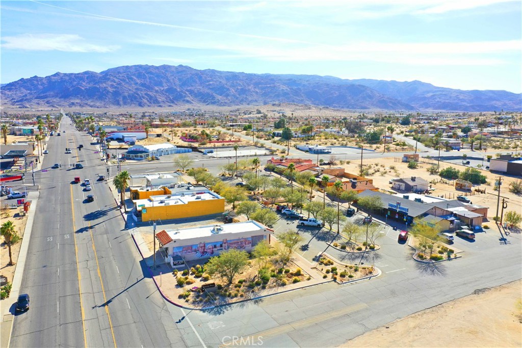 I’m ready to get on the next plane to 29 Palms—this is the opportunity! Historic Plaza is calling, and I’m not wasting another minute. This is a fantastic shopping center in the heart of a vibrant community that’s buzzing with revitalization. Located just minutes from the entrance to the largest Marine Corps base in the world, this property is perfectly positioned to capitalize on high traffic and visibility along Adobe Road, a major thoroughfare.
This stand-alone building is a gem—ready for a fresh start in a growing area full of potential. Think eatery, salons, bars, vintage stores, apothecary shops—all within the plaza. The possibilities are endless! With easy access for shipping and receiving from both Adobe Road and the alley, this property is prime for any business looking to thrive in a community that’s eager for growth and innovation.
Plus, the iconic Joshua Tree National Park is just minutes away, and you’re a short drive from the Tortious Rock Casino, which just celebrated its 10-year anniversary in the area. It’s small-town America with big opportunities, and I’m all in. This is the spot to be, and I’m ready to make it mine—today!
Let's talk business—I’m on my way to see this place in person.