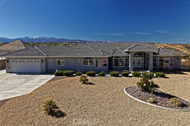 Beautiful Estate home with great views and quick easy access to the I-15 freeway! This property is truly unique with 5 bedrooms, 4.5 Baths, large open kitchen with upgraded appliances, double oven, granite counters and more. Home has 2 fireplaces, one in the living room and one in master bed, master suite has large walk in closet, crown molding, jetted tub, walk in shower, and access to the massive covered patio setup for private times or entertaining. Exquisite World Class Pool with rock structure and walk in grotto containing the spa. Three waterfalls accent this rock surrounded salt-water pool with professional sound system, upgraded filtration system and solar heated. A detached approx. 1000 sqft 4 car garage/workshop with plumbing, 220, forced heat, central air and plenty of room for your toys or hobbies. Outside the garage are RV Hookups, completely fenced with block wall and wrought iron. This home shows pride in ownership and an Eye for quality. Must See! Too much to mention! Association Amenities: None # of RV Spaces: 0 Special Features: BN,CC,,PTRY,TS,WSEC,,WB,WKNONE Frontage Type: Dirt Road Lot Location Type: Standard Location Special Features: Garage Door Opener, Underground Util: # of Attached Spaces: 2 # of Detached Spaces: 4
