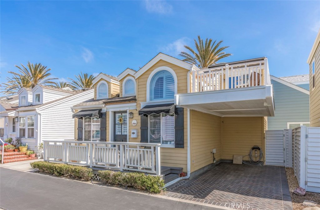 This charming beach cottage is located within the quiet resort community known as Lido Peninsula Resort in the city of Newport Beach. The property features two master bedrooms with two baths on each level, shutters throughout, central heating and cooling and a wide carport. The top deck has scenic bay and boat views making it a great place to gather friends and family to take in the ocean breeze. The lot is located between the pool and private beach and short and a short stroll to the clubhouse. Additional community features include: gaurded entry, security, heated pool, hot tub, gym and plenty of guest parking. No HOA, very low taxes. Optional yacht and boat slips in the area, kayak racks and golf cart parking. Come and see this wonderful beach house today.