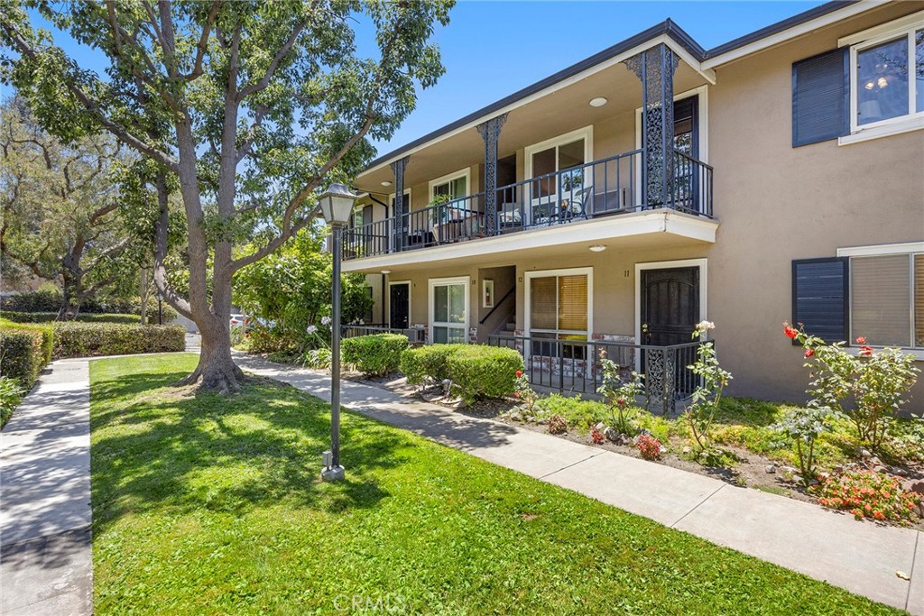 Become a resident of Park Orleans Community located in central Orange, walking distance to Old Towne and just across the road from Hart Park. A wonderful upstairs 2-bedroom unit with a balcony off the living room to relax on and greet those who walk by. Lots of value in what is offered in this HOA: water and trash, pool and spa and a garage that is located nearby. Newer double paned windows and cork flooring are nice upgrades. This unit has been freshly painted and ready to move in. The location is freeway close. Come and meet your new neighbors and take a walk around this development, it will feel like home!