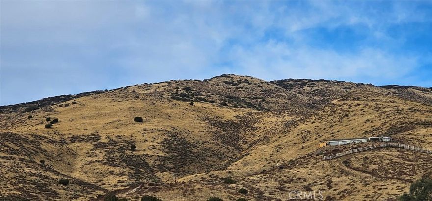 ACTON - 2.5 acres in area of other homes and ranches. Sloped property will afford beautiful views for your custom home.