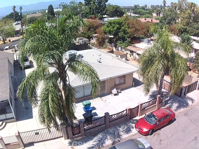 Huge Price Reduction!! Motivated To Sell!! Great income-producing opportunity! This gated 4-bedroom, 2-bathroom home features an enclosed laundry room and recently updated A/C. There's also a shed in the backyard for storage. The property rents for $2,900 a month. Additionally, there's a separate gated entrance to the rear yard, which is rented for $400 a month. The yard has potential for an ADU to generate additional income already has separate utilities ready to go per seller! Centrally located with easy access to stores and the freeway.
