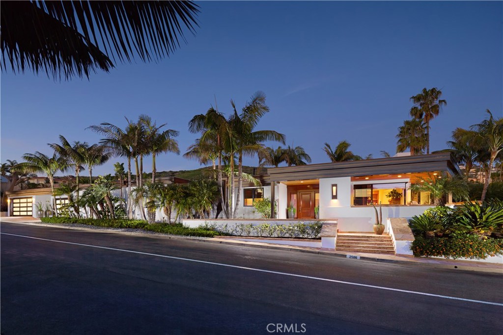Savor breathtaking ocean views and unbridled privacy from this Balinese inspired home in the prestigious, guard-gated community of Irvine Cove. The 4 bedroom, 5 bathroom residence sits on an oversized corner lot and features sophisticated, inviting living spaces accentuated by designer touches throughout. The bright and thoughtful floor plan encompasses dual living rooms, a spacious kitchen with stainless steel appliances, granite countertops and adjoining breakfast area, and formal dining area with outdoor access. Relax and rejuvenate in the opulent master suite, complete with custom wood peaked ceiling and French doors leading to an exterior, centrally located stone spa, also accessible from one of the secondary bedrooms. An abundance of glass and outdoor entertaining areas help the home transition for quintessential interior/exterior coastal living, all against a backdrop of awe-inspiring ocean views. Located on the south side of the highway just a few blocks from the tennis courts and private beach of Irvine Cove, the home is a serene, calming oasis.