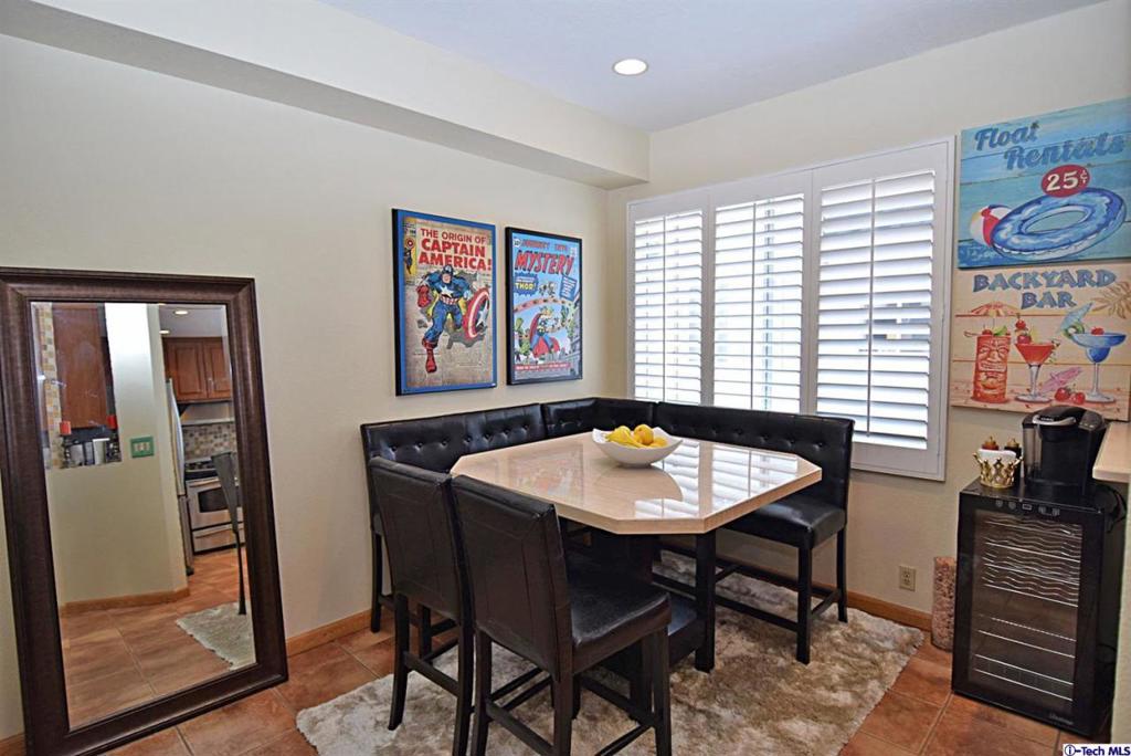 Gorgeous townhome located in the desirable in Reseda. This three level home features an open floor plan of a living room with High ceiling and cozy fireplace, gourmet kitchen with stainless steel appliances, designer tile backsplash and wooden cabinetry, dining area adjacent to kitchen, Two master suite with vaulted ceiling and walk-in closet, master bath with plenty of cabinet space, separate laundry room downstairs can also be used as storage or office space, and two car attached garage with direct access. Other features include recessed lighting throughout, tile flooring, wood flooring in bedrooms, ceiling fan in bedrooms, and front porch entertaining and bbq area. Community sparking pool and spa for entertaining and relaxation. Minutes from shopping, restaurants, and entertainment. Mov