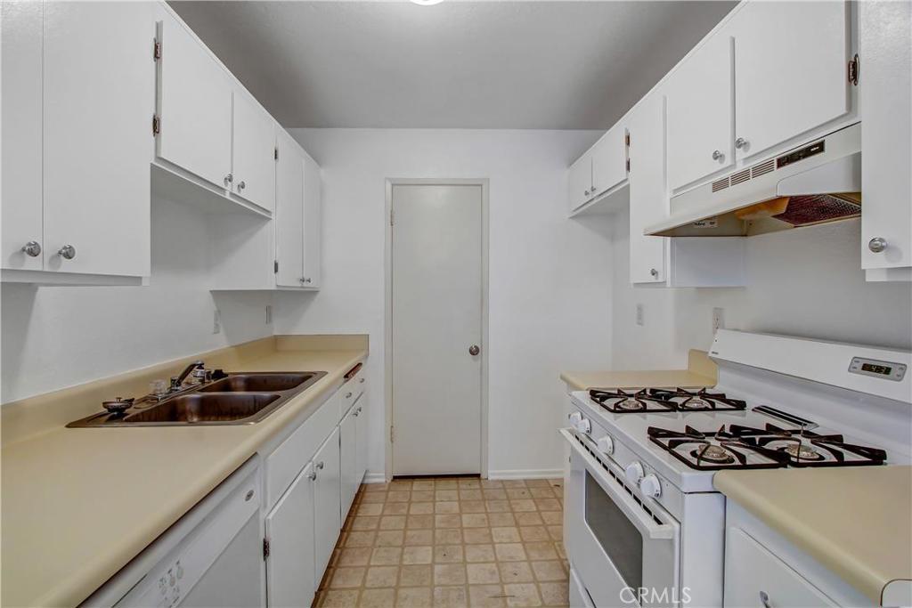 Welcome to Oakview Condominiums. It is a lower level condo with 2 Bedrooms 2 baths and a spacious patio overlooking a private greenbelt area. This unit has a 2 car detached garage which is literally just steps to the entrance of the condo. This cozy home has a large master bedroom with walk-in closet and a separate dining area. It is centrally located and is close to schools, shopping, with easy access to the 91 and 15 Freeways. It is a great new home for someone who is just getting started, and it is also a great investment property. 2 Car Garage is attached to the building but does not have direct access, not very many units with a 2 car garage. The community laundry is also very close to the unit, just merely steps away. The community offers a gated pool and spa with barbeque grills for those beautiful sunny afternoons. The laundry room has each unit's washer and dryer. Each unit is responsible for putting their own washer and dryer in. There is an existing dryer that belongs to the unit and is included in "as is" condition.