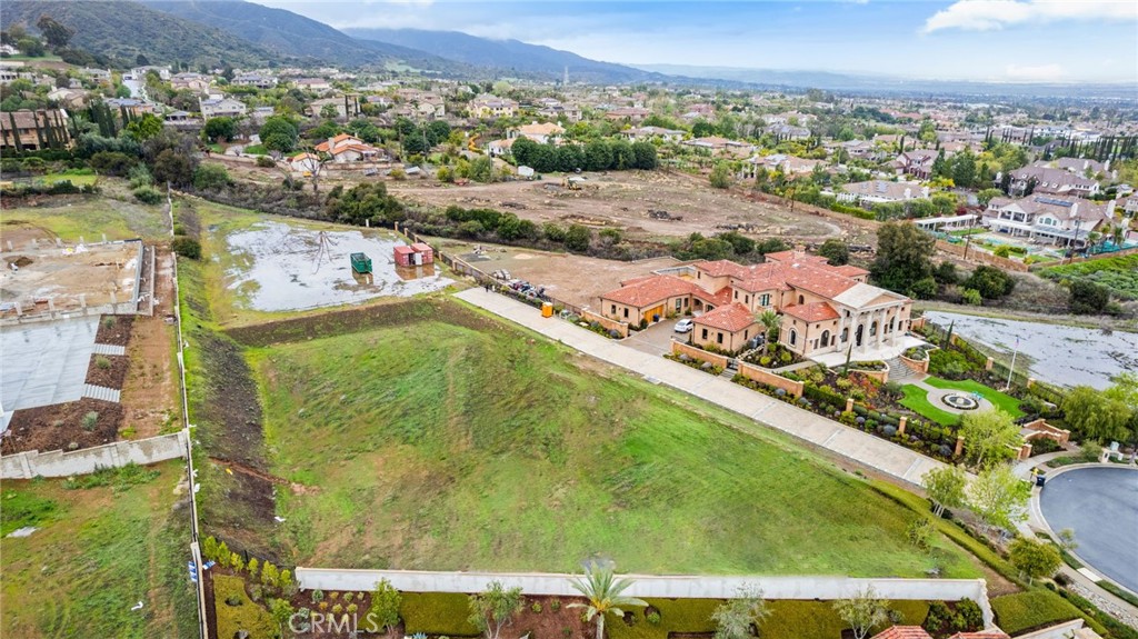 Welcome to Renaissance Estates! A very exclusive community of 12 homes located in a gated cul-de-sac. Lot #8 is situated at the end of the cul-de-sac and offers amazing views of the city, Mount Baldy, Cleveland National Forest, and more.
Quickly becoming one of the most desirable areas to build a custom home, this .92-acre lot is the perfect place to make your dream home a reality.
Plans are ready for you to build a 7,000+ square-foot home. Each lot in this community is a minimum of 40,000 square feet, and all lots are ready to build. Design your dream home to take full advantage of the stunning views of the surrounding mountains and city lights.
Architectural styles allowed by the HOA include Mediterranean (Italian Villa/Italianate), Tuscan, Andalusian, and Santa Barbara.