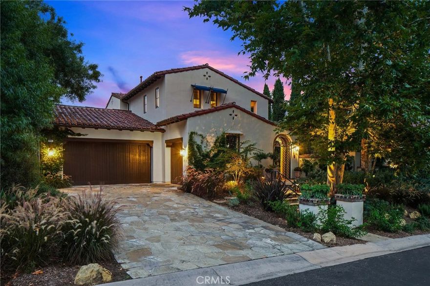 Experience the epitome of old-world charm with the convenience of luxury modern-day living in this beautifully appointed and recently remodeled Spanish Revival villa.  Nestled atop a large private lot with resort-like grounds, the home is located in the prestigious Villa Sycamore neighborhood of the exclusive gated community of Shady Canyon that features 16,000 acres of preserved rolling hills that cocoon the area from the outside world. Feel welcomed through the glazed Spanish tile and wrought-iron arched entry gate into the gorgeous front courtyard complete with a serene outdoor fountain. The open living/dining room in the center of the home showcases a double-height vaulted ceiling with exposed wood beams, a stunning fireplace and rows of French doors lining both sides of the room, providing a seamless transition between indoor/outdoor living. The spacious large yard that surrounds the entire estate includes multiple outdoor living areas with exterior fireplaces, a highly upgraded covered patio, outdoor televisions and lighting, a sparkling pool with elegant waterfall features, and a custom covered outdoor kitchen. Inside, the updated chef’s kitchen includes new state-of-the-art appliances including a built-in SubZero fridge, with additional fridge and freezer drawers in the butler’s pantry, a Wolf steam oven, and custom BlueStar commercial gas range/oven. An attached breakfast room and family room connected to the kitchen creates the perfect floor plan for both entertaining and everyday living. The oversized primary suite is replete with a new built-in desk space, remote controlled fireplace, upholstered walls, a massive walk-in closet and a completely rebuilt luxurious spa-like bathroom with dual vanity sinks, radiant heated flooring, antique glass wall, and a built-in sauna. The additional four bedrooms with remodeled ensuite bathrooms complete the estate, including a private casita which can be used as either a fifth bedroom or office. Additional amenities and new upgrades include a 500-bottle temperature controlled wine cellar, new plumbing, limestone flooring, owned solar panels and house battery, a whole house water softener and filtration system, security cameras and video storage system, and indoor/outdoor Sonos speakers. A truly timeless property fit for even the most discerning of occupants.