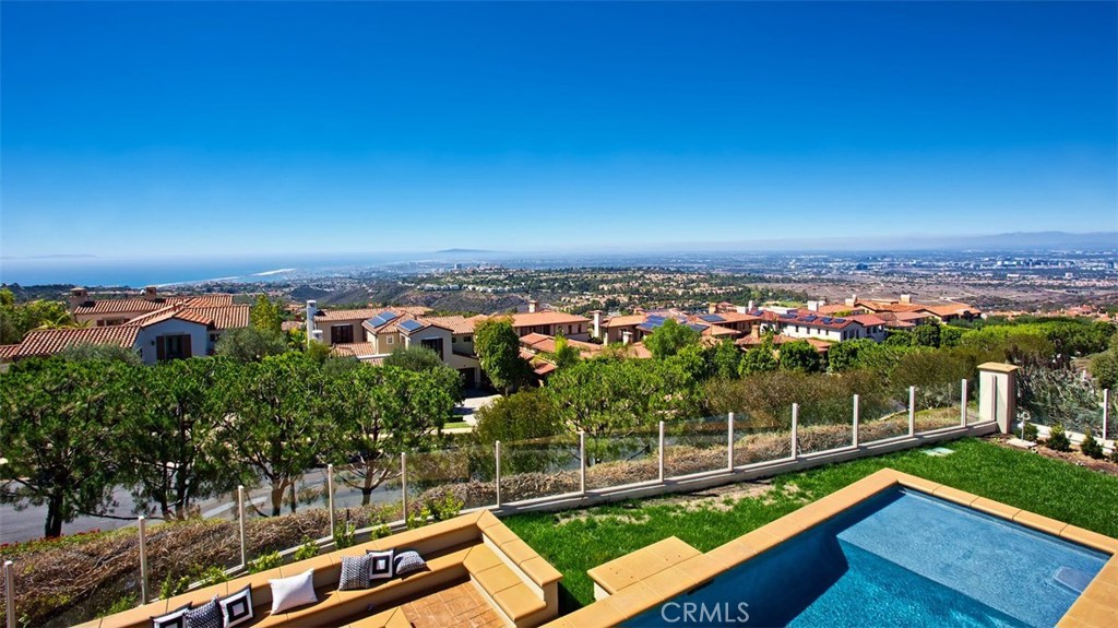 LUXURY REO...Live the luxurious yet laid-back Southern California lifestyle at this beautiful home in Ocean Heights. The exquisite property impresses with some of the best views in Orange County of the ocean, city lights, and mountains beyond. Enjoy this approximately 6,067 square foot estate in your guard-gated community that features four en-suite bedrooms (including one on the first level), plus an office that includes a closet and bath with a spacious upstairs room including closet and bath that can be used for a family room, media room, or playroom—the possibilities are endless. You will see only the finest appointments in this home, such as newer Shaker-style cabinets, a large kitchen island made with Carrara marble, three fireplaces, elegant hardwood flooring, and newer appliances. The entertainer’s backyard showcases a pool, spa, and fire pit—ideal for both intimate gatherings and huge soirees. This gorgeous, light-filled estate is ready for you to call home.