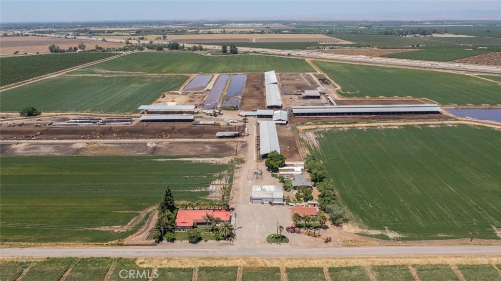 Dairy Facility! 204 Total Acres consisting of 155 farmable acres with Class One Merced Irrigation District water and deep well, The other 49 acres being used as a Dairy facility, permitted for a total of 2,200 animals with 1,900 lactating cows. This property currently has 1,260 free stalls along with lock ups. The milk parlor is double 16 parallel with milk storage capacity over 7,000 gallons. Also equipped with commodity/hay barn storage area and plenty of water storage lagoons. Let's not forget about the three homes on the property along with 7 additional mobile homes! There's truly so much more to be seen for yourself!