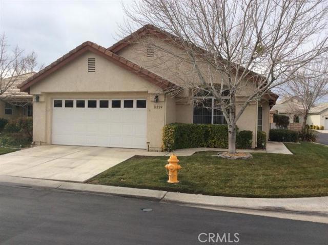 This well maintained single family home is located in the Wyndham Rose area of Jess Ranch, a beautiful 55 and over community. The original owners have taken great care of this property, from the inside out! The interior features a tile entry and tile baths, plush carpeting in bdrms and living areas & tile counters in kitchen and baths. Dramatic vaulted ceilings give the living room an open feel, and windows let in lots of natural light. Kitchen has oak cabinetry and breakfast nook. The two bedrooms are good sized, one with walk-in closet and spacious bath and shower area. Owner added a wonderful sitting patio area off the master bdrm and another outdoor cooking area that is great for firing up the bar-b-que. The corner lot is a great location and has ample grass area, lovely trees and plants and block wall fencing. There is an indoor laundry area and the garage has ample storage too. Window blinds and draperies stay, along with refrigerator. One year new washer/dryer are negotiable # of RV Spaces: 0 Special Features: BN,CC,,PTRY,SK,POOL,CLUB,TENN,GOLF Lot Location Type: Standard Location Pool Features: Common Pool Special Features: Garage Door Opener, Underground Util: # of Attached Spaces: 2 # of Detached Spaces: 0