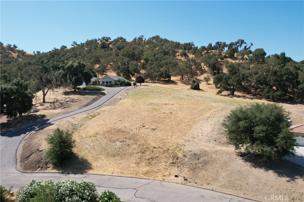 Build your dream home on this beautiful lot in the exclusive River View Estates gated community near Lake Nacimiento featuring custom homes on 1± acre lots. This lot is one of the most elevated lots in the community offering exquisite panoramic views of the countryside.
Included are plans and studies ready to submit to the County Planning Department for a brand new Home and Guest House that have been approved with the ARC. Utilities are available in the street. As a bonus, the property has prepaid for Water Unit Capacity and Hookup fees - currently valued at $11,885.
Amenities of the Heritage Ranch Community include a launch ramp, swimming pools, children’s playgrounds, tennis court/pickleball court, a recreation barn, an equestrian area, and riding and hiking trails. The location is convenient, just a short distance from a K-8 school and a commercial center featuring a full-size grocery store, restaurants, and gas station.
Give us a call today for a private viewing of this beautiful one-acre parcel!