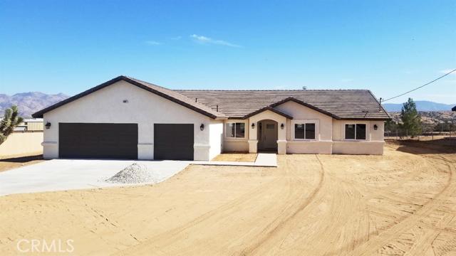 Come see and fall in love with this 2059 sq. ft, split floor plan, gorgeous new construction. Nestled in a cul-de-sac in Southwest Hesperia. We invite you to walk into an open spacious grand room with corner fireplace. Beautiful open kitchen with Quartz countertops, stainless steel appliances, corner Pantry including a large center island for all the cooks. Master bathroom has beautiful tiled walk in shower and separate tub with a spacious walk-in closet. Ceiling fans in all bedrooms including grand room. Indoor laundry room and finished 3 car garage. Beautiful panoramic views of mountains from backyard with walking, running or bicycling trails nearby. Come see this BEAUTIFUL home & Bring your offers! Association Amenities: None # of RV Spaces: 0 Special Features: CC,FS,,PTRYNONE Lot Location Type: Standard Location Special Features: Garage Door Opener # of Attached Spaces: 3 # of Detached Spaces: 0
