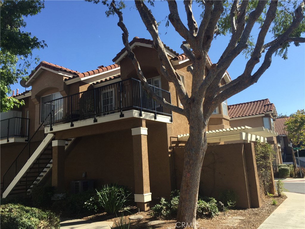 Very lovely and upgraded 2 bedroom 2 bath condo. Newer wood laminate floors, and great remodeled kitchen features granite counters. Cozy fireplace in living area along with custom plantation shutters, and very functional open floor plan. 1 car garage. Corner unit location. Close to schools, parks, shopping and entertainment. Shows light and bright... move in condition.
