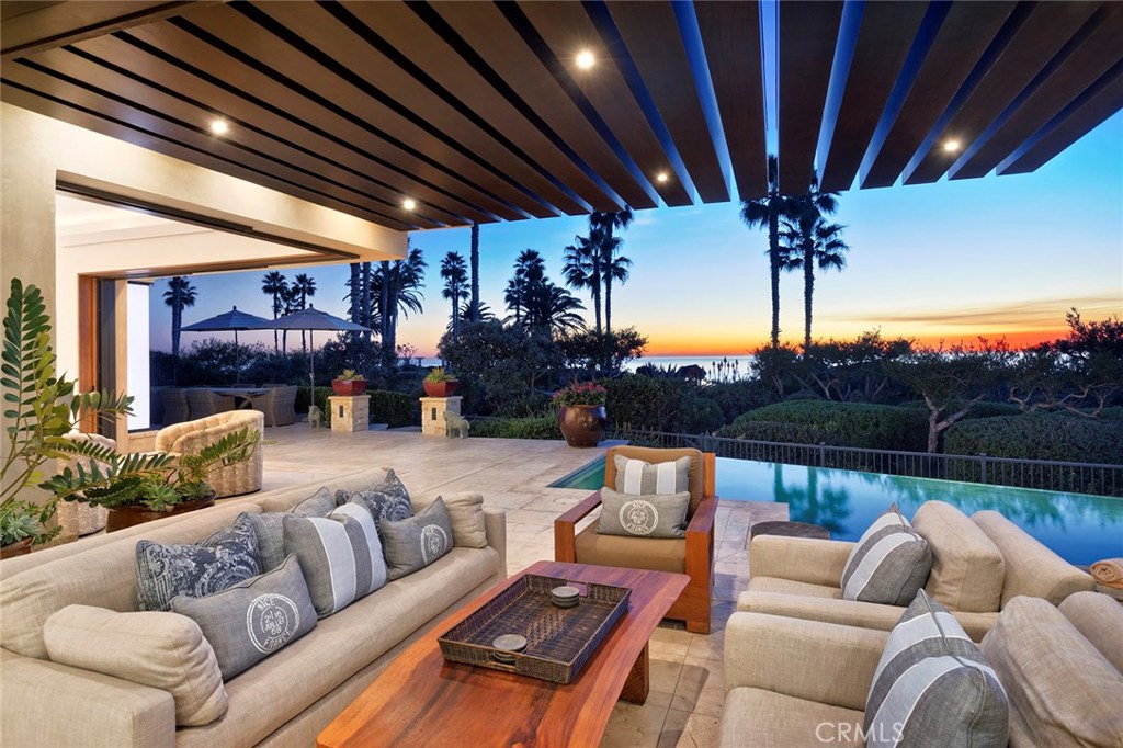 Tucked into the coveted front row of Montage Residences, this contemporary home seamlessly interfaces interior and exterior spaces for a luxurious seaside living experience. Mahogany and glass doors disappear into the walls, merging indoor areas to the Catalina Island and ocean view lanai. High ceilings complete the airy ambience perfect for enjoying the golden hues of each Pacific sunset. No feature or amenity has been forgotten. Electronic systems for lighting, environment, and audio visual are integrated for convenient monitoring. Owners enjoy access to all Montage amenities: Spa Montage, Mosaic Pool, dining at the Loft and Studio. Personal services such as concierge, housekeeping and engineering support are also available. Truly a unique and tranquil opportunity.
