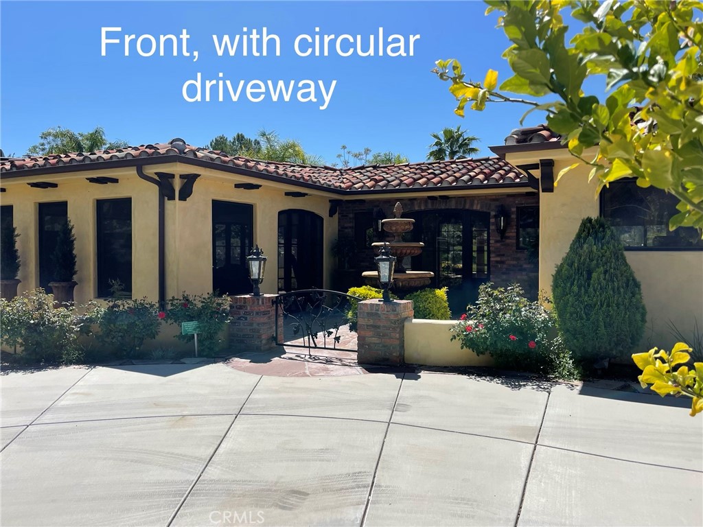 Arguably the most noticeable lot at the Ranch, lot 411 sits in front of the Main Club House and commands attention as you drive by. It offers a curving driveway that can park two cars and your golf cart comfortably. A long lot, it can accommodate your longest RV and still have room for a vehicle up front. A wide lot, it is pie-shaped so there is a liberating sense of space and not elbow-elbow with nearby lots. It has a fountain and private courtyard
entry. Amazing views of the Palomar Mountains in the back as well being on the water and golf course view. The best of outdoor and indoor living!