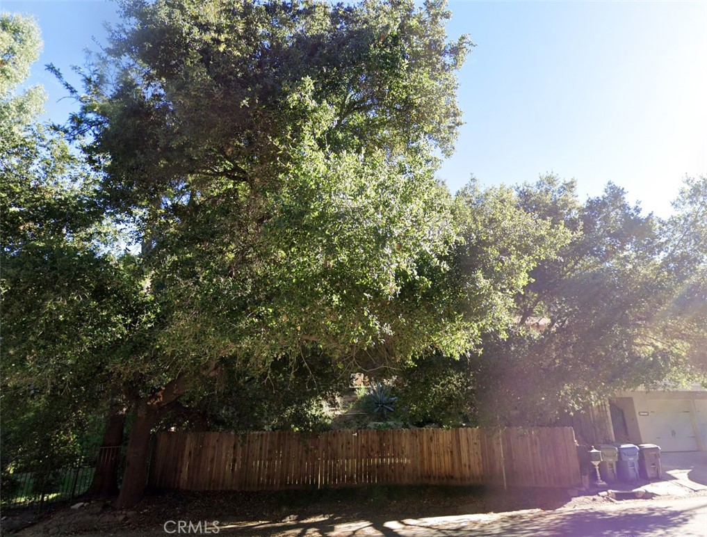 Incredible and rare opportunity to purchase one of the few remaining buildable vacant lots in the Woodland Hills area, filled with luxury homes and estates. Situated in a quiet tree lined area South of the Blvd, this property is available to visionary developers, builders, or entrepreneurs looking to build their next project or dream home. Adjacent to the Woodland Hills Country Club and several parks, a newly built home would be poised to take advantage of the surge in popularity over the last few years in the area. The upslope lot has a significant flat pad area in front, and utilities are available at the street. Owner has survey, soils, arborist report, and other supplementary materials perfect for a head start on designing your next project. Please inquire for more information or due diligence material on this remarkable chance to begin your next vision.