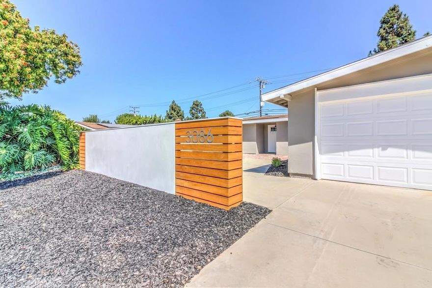 Welcome home to this beautiful interior tract home in Mesa Verde! From the moment you walk in the door you will see the attention to detail with high ceilings and custom finishing touches. Hardwood floors and large baseboards will lead you throughout the home. The large open kitchen features custom cabinets with island, Carrera marble countertops, stainless steel appliances, chrome pendants and Jeffrey Court beveled tile backsplash. The bathrooms feature floating vanities, custom shower glass, Jeffrey Court beveled tile, Kohler shower faucets, and polished tile. The exterior is beautifully landscaped with sod and privacy trees in the backyard.The wall with smooth white stucco and Ipe wood gives the home the style your clients has been waiting for!