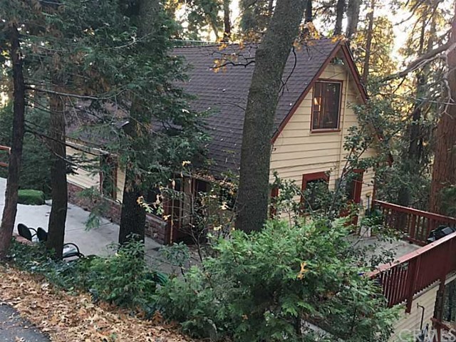Cute Vintage Cabin Located In The Coveted Strawberry Lodge. Located On Three Lots With Great Forested Views, This Home Has Been Loved. Maintaining The Vintage Charm With Pine Tongue And Groove Wood But With Upgrades Including New Plumbing And Electrical, Roof, Water Heater And Forced Air Unit For Cozy Warmth. Large Work Shop Under Home Too! Great Rental History - Full Time Tenants Do Reside In Home So Please Call To Show.