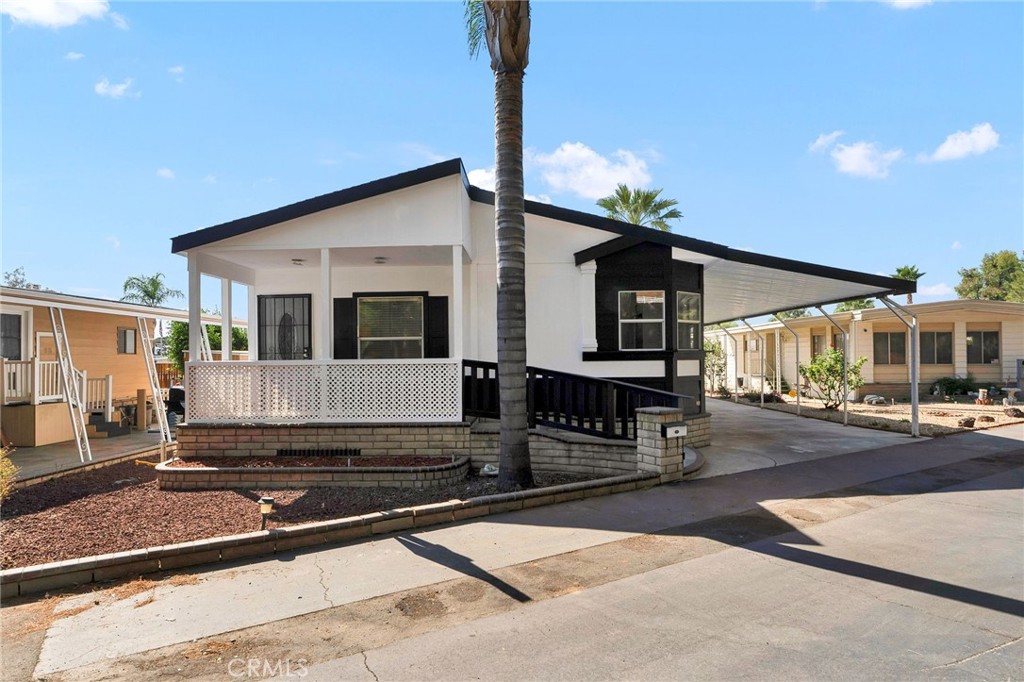 Welcome to Casa Valente Unit #42, a beautifully remodeled home in a vibrant 55+ community! This spacious 3-bedroom, 2-bath residence boasts an inviting open floor plan. The updated kitchen features stunning quartz countertops, brand-new appliances, and stylish laminate flooring. Enjoy comfortable living in a welcoming environment—perfect for relaxation and socializing!