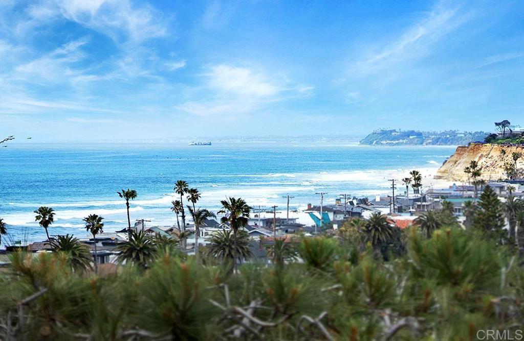 This one-of-a-kind iconic Del Mar Estate is unlike any other property offered in any high-end Southern California coastal community. This inimitable property has over 175 feet of ocean-view frontage situated on a private bluff of approximately 1/2 acre of usable land capturing unobstructed Pacific Ocean, white water and sand views of the Pacific coastline. This secluded home is generously sized with nearly 5,300 square feet situated to the west of Camino Del Mar. This Estate is simultaneously an entertainment haven and a spa-like sanctuary with sounds of waves enhancing its ambience. The state-of-the-art kitchen seats up to 18 guests with the estate seamlessly opening to multiple indoor-outdoor entertaining areas. The home boasts numerous spa amenities such as a centrally located over-sized heated pool, 2 hot tubs, a massage /exercise room with ballet barre and yoga rope wall, steam shower, and an oversized dry sauna, all connected by a Sky Bridge. In addition to its unobstructed views and remarkable privacy, the Estate is uniquely positioned in the heart of all the best amenities which Del Mar has to offer. The home is a mere 1-minute stroll to the nationally recognized L'Auberge Del Mar Resort and Spa, the shops at Del Mar Plaza, and numerous other top restaurants, cafes and boutiques. The house is a 3 minute walk to Del Mar’s renowned surfing beach with its contiguous grassy park and playground. The iconic architecture artistically diffuses natural light throughout the 5+ generously sized bedroom estate. Modern white walls and high ceilings further complement the contemporary design and serve as a gallery-like backdrop to showcase collectible artwork in the abundant living spaces. Unique in Del Mar, the property also has a private driveway, motor court, with onsite parking that can accommodate up to 12+ cars, as well as having a separate service entrance. Due to its large parcel size, the home has available excess Floor Area Ratio (FAR) for possible expansion, in addition to having a private footprint for a potential ADU also with prime white water ocean views. Without question, this is a quintessential Del Mar Estate that cannot be replicated again. Seize the chance to own a piece of Del Mar's history and create a lasting legacy. Buyer to verify all prior to COE.
