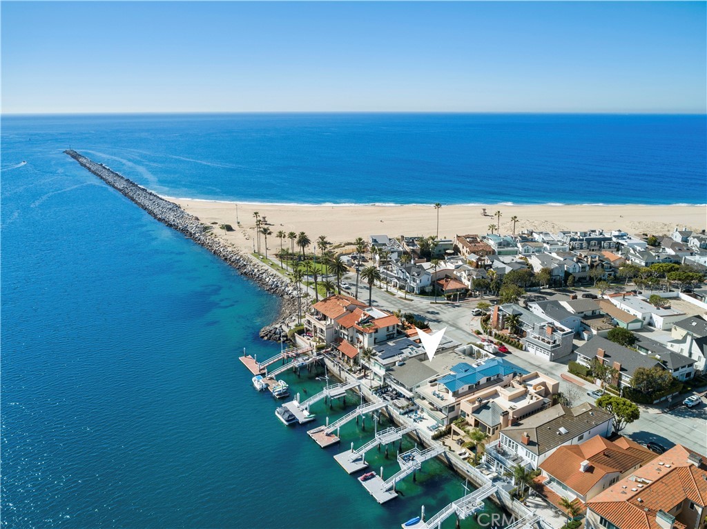 Boasting a prime bayfront location at the tip of the coveted Balboa Peninsula Point, 2286 Channel Road is truly extraordinary. Recently retouched and remodeled, this home truly embodies coastal living -a private dock and patio, a three-car garage, and an exceptional 3,500 sq. ft. of living space with one of a kind views of the harbor. An excellent choice for entertaining, the home features 5 bedrooms, an office, 4 bathrooms, open living spaces, a pristine white kitchen with stainless steel appliances and an ocean view deck with a retractable awning. The secluded master suite features tall ceilings, access to a spacious, private roof garden, and a spa-inspired en suite bathroom with dual sinks, a large vanity, custom lighting fixtures overhead, and a luxurious Roman soaking tub. A light and bright color palette of crisp white, complemented by natural hues creates the perfect canvas for a seaside oasis while exhibiting quality craftsmanship and attention to detail. Comfortably situated in one of the most desirable areas of Southern California, this remarkable home offers an exceptional blending of elegant coastal living, with the always-familiar sights and sounds of the ocean, and is located just minutes from the Balboa Island Ferry, Fun Zone, the Wedge, and the world-class dining, shopping, and amenities of Newport Beach.