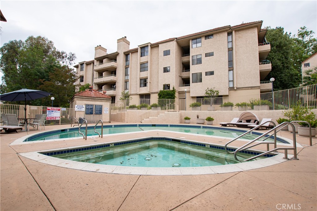 Excellent ground floor end unit in the coveted Drake Terrace condominiums featuring 2 bedrooms and 1 bathroom, which has an entrance from the primary bedroom as well as the hallway. There is a separate dining area, plus space for a breakfast table in the kitchen. There is carpet throughout the unit, which has a spacious living area with fireplace. The unique positioning of this condo also means there are no common walls other than the upper unit. The extra-long patio faces the pool and is accessible via sliding doors in both the living area and primary bedroom. The complex also features tennis courts and is near hiking trails and parks. Sale includes all appliances and two assigned tandem spaces in the covered garage. Come make it yours today!