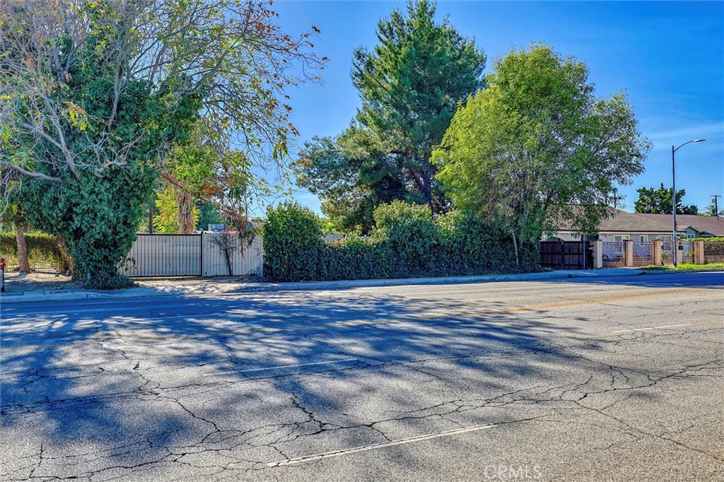 Back on Market on 5/12/2025 subject to cancellation of the escrow. Buyer could not perform. Builders special with possibilities of multifamily, commercial or mixed-use development! Secure gated horse property. Boasting rare street-to-street access from Nordhoff or Sunburst, the property is ideally positioned adjacent to the 4 story West Valley Library and steps away from public transportation, making it a commuter’s dream. With zoning that permits horses and potential to add multiple ADUs (buyer to verify), this property is a blank canvas for a creative visionary. For savvy developers, the lot's potential is even more enticing: split the parcel into 4-5 individual lots, or possibly take advantage of state bills prioritizing affordable housing to build multiple units. This property ticks all the boxes for those looking to capitalize on the push for affordable housing in the area—though buyers are encouraged to perform due diligence on obtaining the necessary approvals for new construction. Whether you're imagining a dream home oasis, a lucrative multi-unit investment, or exploring the possibilities for building affordable apartments, 16326 Nordhoff St. offers an exceptional opportunity in a high-demand area. Act quickly—opportunities like this don’t last long! The house is approx 2,100 SF, 3 BR 2 BA, with beamed ceiling & sunlights, enclosed patio with office space and laundry, fireplaces in LR and primary BR, an enclosed gym, and a 15x30 pool. There’s a permitted guest house, equestrian keeping area and exercise ring, and tons of space for storage. Front U driveway with two entrances, easy in an out with trailers / eqpt and/or ample off street guest parking. Inside the gate down the driveway is a 3 car carport. Workshop area with plenty of space for tools / storage. The Horse paddock is fenced, has 3 small stall shelters, one with turnout. 25x80 exercise round pen in back, a two-story accessory building off of the pool with a deck and power; great for a kids playhouse / game room / pool house / art studio. Permitted guest house is ~800 SF, with sunny full kitchen and full bath which has a private entrance off Sunburst. Property has access from two streets: Nordhoff & Sunburst. Located in a transit rich corridor on a major street. Close proximity to shopping, restaurants, fast food, public transportation, business centers & CSUN. List price is for land value only. Property being sold in an as-is condition. Call for details.
