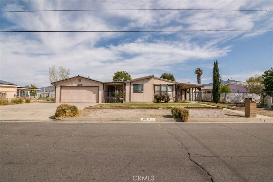 Manufactured home on its own land and NOT in a 55+ community. Come check out this tremendous opportunity. 3 bedroom 2 bath with an nice open floor plan.  The home has many nice features including NEW Flooring, detached garage with a craft room / workroom and a 1/4 bath, a good sized fenced yard and RV parking with dump and hookups.