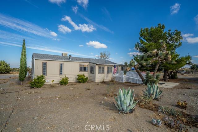 FANTASTIC LOCATION! Just north of Phelan Rd and Close to town. This immaculate triple wide manufactured home shows pride of ownership. This 3bd/2ba has wonderful large open kitchen with island that is open to a huge family room with wood burning stove. There is also an added living room. The master bedroom offers a spectacular walk in closet. You can enjoy the enclosed front patio and open side porch with fenced area for your pets. The property is fully fenced and there is a carport and large storage building. This is a must see! Association Amenities: None # of RV Spaces: 0 Special Features: SHNONE Frontage Type: Dirt Road Lot Location Type: Standard Location # of Attached Spaces: 0 # of Detached Spaces: 0