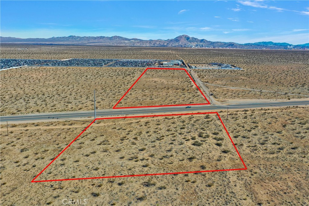 This 11.54 acre parcel is adjacent to the 395 Hwy. There is one portion of the parcel that is on the West side of the 395 and the majority of the parcel is on the East side adjacent to the parts yard. Approximately 330ft of frontage on the East and West side of the 395. This parcel is zoned Airport Development District+Cannabis. Property line markings are approximations. The use is described as follows and is very general. The Airport Development District (ADD) provides for a wide range of nonresidential uses, generally encompassing light
and heavy industrial, retail, office, and other commercial uses that are oriented around airport operation, services, industries
and businesses. The Airport Development District is intended to provide maximum flexibility to the City, landowners, and
tenants in establishing and operating non-residential uses. Development is expected to be predominated by buildings of one
(1) or two (2) stories, but may attain any heights up to fifty-five (55) feet . In some cases, retail uses will be on the ground
floor, with offices above. All uses in this district will be required to execute aviation easements.