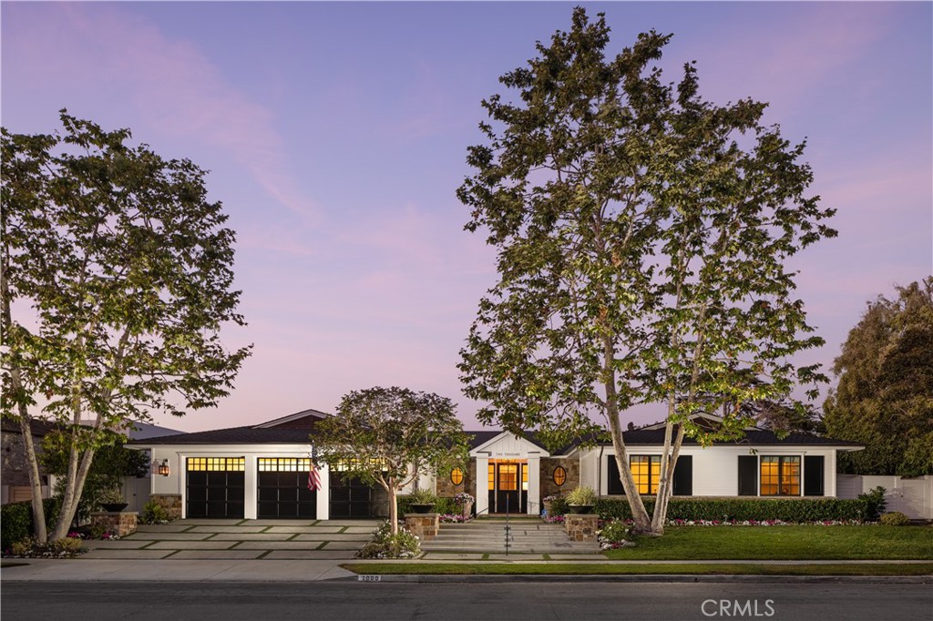 This traditional Irvine Terrace property is situated on over a 13,000-square-foot lot. A spectacular large backyard with an impeccable layout that encompasses a pool/spa, covered patio area, a built-in barbeque, and plenty of open space for entertaining. The front yard sets the tone for tranquility leading into the thoughtfully designed open floor plan. The stylish living spaces include both living and dining areas, an open family room that sits just off the chef’s kitchen fitted with professional-grade appliances, and an oversized center island with a breakfast area. The expansive living room and sun room include a sitting area and a two-way fireplace that leads to the lushly landscaped backyard. Ideal for entertaining, cantilevered doors allow indoor and outdoor spaces to flow. This home is perfect for both entertaining and intimate family gatherings.