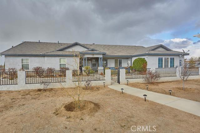 Beautifully upgraded 4 bedroom 2.5 bath home has been immaculately kept and is located just a short distance from pavement. The features include an open modern layout, formal dining, cozy pellet stove, stainless steel appliances, pantry, 3 car garage, covered patio storage shed, RV hook ups, automatic gate, spa, and so much more! Also, has trees that line the property with a drip system, and automatic sprinkler system in the front and backyard, Located in the Snowline School District, with beautiful views of mountains to the south, and the valley to the north, and zoned for horses.