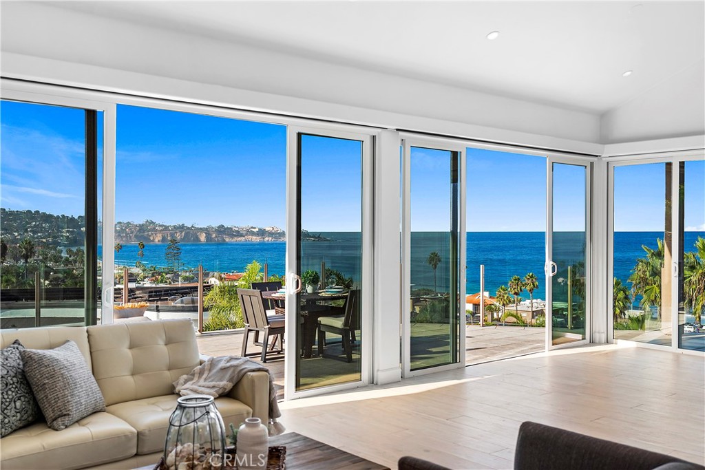 Panoramic ocean and whitewater views from this estate property located in the only luxury single-family home gated community in La Jolla. Montoro is an exclusive gated community of custom built homes with elevated white water views overlooking the La Jolla Shores. Highly upgraded and professionally designed modern 6 bedroom and 7 bath home is located a short stroll from the world class beaches of La Jolla. The gated courtyard leads to a high end modern front door. The formal entry with vaulted ceilings opens to the endless views. This home is professionally designed and upgraded including. Entertainers paradise with a large open great room, immaculate kitchen, breathtaking views of breaking waves, surfers, and the expansive Pacific ocean. A well designed and expansive island, high end stainless steel appliances, upgraded stone countertops, brand new custom cabinets and custom backsplash. Highly desired open concept with the kitchen open to the dining area, living room and family room which both have fireplaces with custom surround to the ceiling. Multiple sliders open from the kitchen dining area and living room to the deck which provides a spacious yet comfortable space for family and friends. Ample natural light throughout the home with million dollar views from almost every room. The large family room features oversized windows with hidden electric shades to take advantage of the views, a modern custom fireplace and can accommodate multiple seating areas. The main floor master retreat offers the same views, sitting room with a private deck and en suite with his and hers side of the bathroom. The ensuite has his and hers sinks, two walk in closet, two water closets. glass enclosed walk in shower and freestanding soaking tub. Downstairs are five secondary bedrooms and most have nicely upgraded ensuite bathrooms. One of the rooms has a separate entrance as well as direct access from the home and is perfect for in-laws, guests or a housekeeper or nanny. Several of the secondary bedrooms offer direct access to a balcony. The great room can be used as a second living area, theatre, game room, in home gym and study. Off the great room is a wine cellar. There is an indoor laundry room and direct access to the three car garage. Montoro community amenities include tennis courts, pool, and spa. Close to fine dining, boutiques, entertainment, UCSD, Scripps and La Jolla Village. Plenty of room for a private pool and spa.