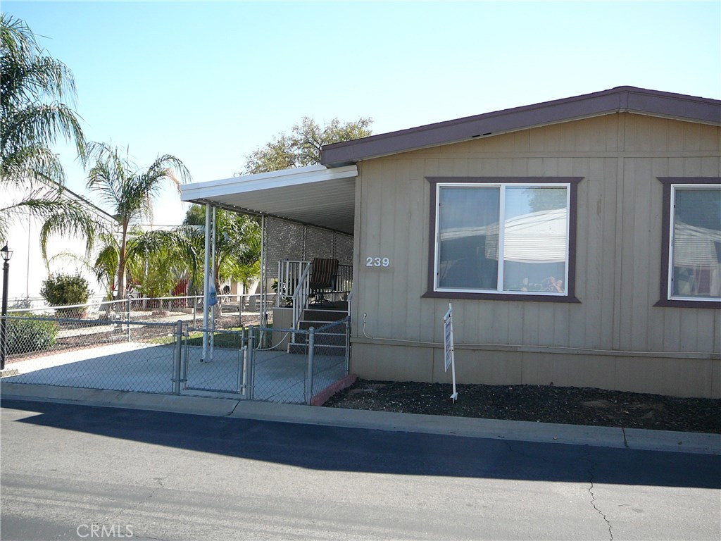 HILLSIDE MOBILE HOMES IS A 55+ GATED COMMUNITY. THIS HOME HAS BEEN REMODELED TO INCLUDE DRY WALL THRU OUT, WOOD FLOORS, NEW CARPET, DUAL PANE WINDOWS FOR ENERGY SAVINGS PLUS THE KITCHEN HAS BEEN REDMODELED WITH NEW CABENETS AND ISLAND FOR MORE WORK SPACE AND EATING COUNTER. IT HAS 2 BEDROOMS, 2BATHS AND AN ADDED ROOM - CAN BE 3RD BEDROOM OR CRAFT ROOM OR STORAGE ROOM. YOU CAN PARK 2 CARS IN THE CAR PORT. THERE IS A SHED FOR STORAGE. THERE IS A LARGE COVERED PORCH FOR ENJOYING THE EVENING BREEZE. ALSO THERE IS A FENCED AREA FOR SMALL DOGS AND A BEAUTIFUL GRASS SIDE YARD. YOU ARE CLOSE TO THE CLUB HOUSE, SWIMMING POOL, JACUZZI, BILLARD ROOM AND OTHER ACTIVITES. THE PARK IS CLOSE TO GOLF, SHOPPING, CHURCHES, RESTAURANTS AND HOSPITALS.