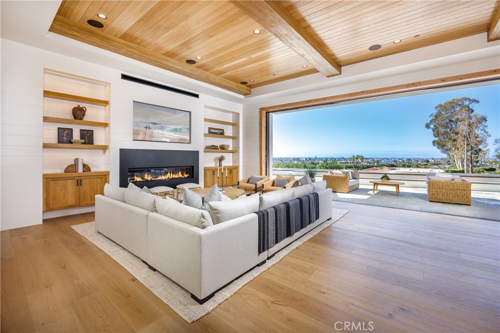 Stunning new construction by Legacy Custom Homes. Ideally located on the front row in Irvine Terrace, with gorgeous views stretching from Balboa Island, Catalina Island, Newport Harbor and city lights as far as the eyes can see. This custom single level home has four generous ensuite bedrooms, an office, stunning millwork and custom cabinetry throughout, a four car tantem garage, and an incredible Chefs kitchen that opens to the great room with custom La Cantina doors creating the perfect flow of indoor-outdoor living. Within walking distance to Fashion Island shopping, top rated restaurants, Newport Beach Country Club, Corona del Mar village and some of Southern California’s most beautiful beaches, this unique home is a must see.