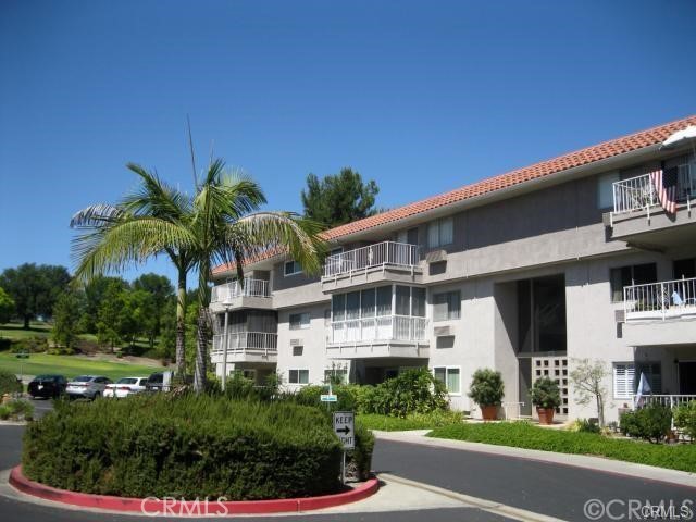 Golf Course view! Top floor of a 3-story elevator bldg. Open and Airy, spacious 1 bedroom, 1 bath condo offers 3 custom sky lights. Light & bright, open plan.
DON'T MISS THIS GARDEN VILLA CONDO IN THE PERMIER 55+ COMMUNITY OF LAGUNA WOODS.
Approx.1000 sq ft (Est), the charming, upgraded home features a large living & dining "great room" with walls of
windows overlooking the golf course & treetops, sliders opening onto a private balcony perfect for relaxing or dining.
The far end of the living room has a custom-built wall of sliding mirrored wardrobes, adding tons of extra storage.
An all-white kitchen offers white appliances & custom garden window. Updated bathroom has grab bars/newer glass
shower enclosure/updated lighting. The master bedroom features two separate mirrored wardrobes.
Other features include: 3 sky lights in "Great Room" and bath, added recessed lighting; custom baseboards; custom contemporary glass double-door entry.
New Air conditioning unit; neutral designer-paint scheme with contrasting white trim & doors; custom tile
flooring; carpeting in living room, master bedroom, ceiling fans. There is a central laundry room just steps from the unit.
Assigned parking (1 space plus storage cabinets) is underground & easily accessed by elevator. Monthly Rent includes
water/trash/security/association amenities.