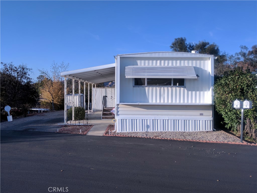 Seller says "Let's get it Sold!" Every Room in this Terrific Home was Designed so Well with Ample Storage and Space in Mind! Large Bedroom has 2 Closets with built-in Drawers under closets and Mirrored Corner Vanity with 3 Drawers on each side. Bathroom has Separate Tub & Shower along with a very Appealing Corner Sink and Vanity. Open, Spacious Living Room has built-in Book Shelves with Display Cabinet and Large Window & Slider that lights up the room! You will be Amazed at all of the Cabinetry and Storage in the Kitchen! There is even room for a Dinette Set! Kitchen Appliances include Oven, Gas Cook Top and Refrigerator. Be sure to look at the Spice Cabinet behind the Cook Top! Washer and Dryer (included) are in the Shed just outside the hall door under the Covered Patio. Low Maintenance Landscaping includes Fruit Trees and a fenced area for Your Dog or Garden! Nice Corner lot Location in a Clean Senior 55+ park with Low Space Rent only $335 month! This Home has Everything You are looking for!