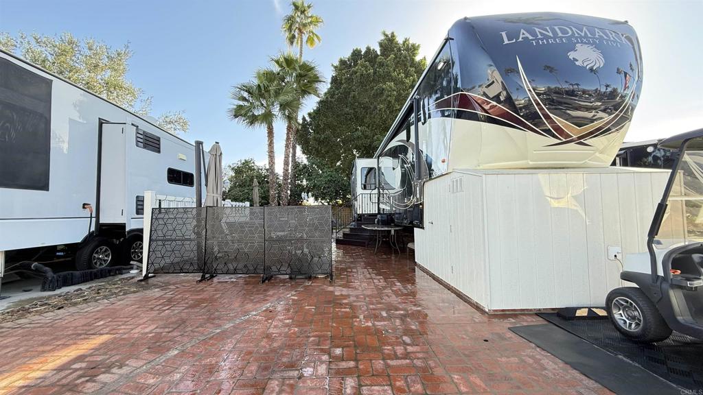 Lot 886, East wall, mid resort, this beautiful used brick lot offers vast Mountain View’s with privacy in the entertaining area. Outdoor furnishings are carefully thought out and add a welcoming appearance, privacy screens, trex steps and doghouse. 2019 Newport 365 fifth wheel included, or contact us for individual pricing. Outdoor Resort Palm Springs (ORPS) is a Guard Gated 5-Star RV Resort Community offering an active and luxurious lifestyle featuring golf (27 holes), tennis, pickleball, swimming and more! Two clubhouses, fitness center, beauty solan, La Roma Restaurant on campus, dog park and more!