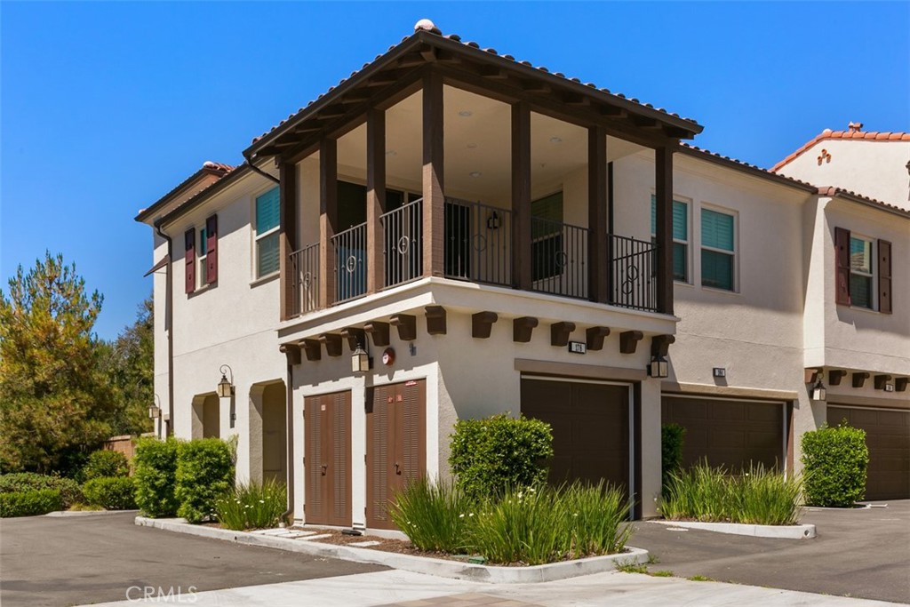 Attractive two bedroom, 2 bath condominium in sought after Agave neighborhood of Portola Springs. Hardwood floors and carpeting, open kitchen area to living room, stainless steel appliances and granite countertops. Separate dining room. Custom window coverings, largest bedroom with walk in closet and additional space for an office. Light and bright with windows and sliding glass door out to large deck with a view of the hillside. 2 attached garage spaces. Community amenities include, tennis court, barbecue areas, swimming pool and spa, basketball courts and playground. Close to expressways, the Irvine Spectrum and shops and restaurants.